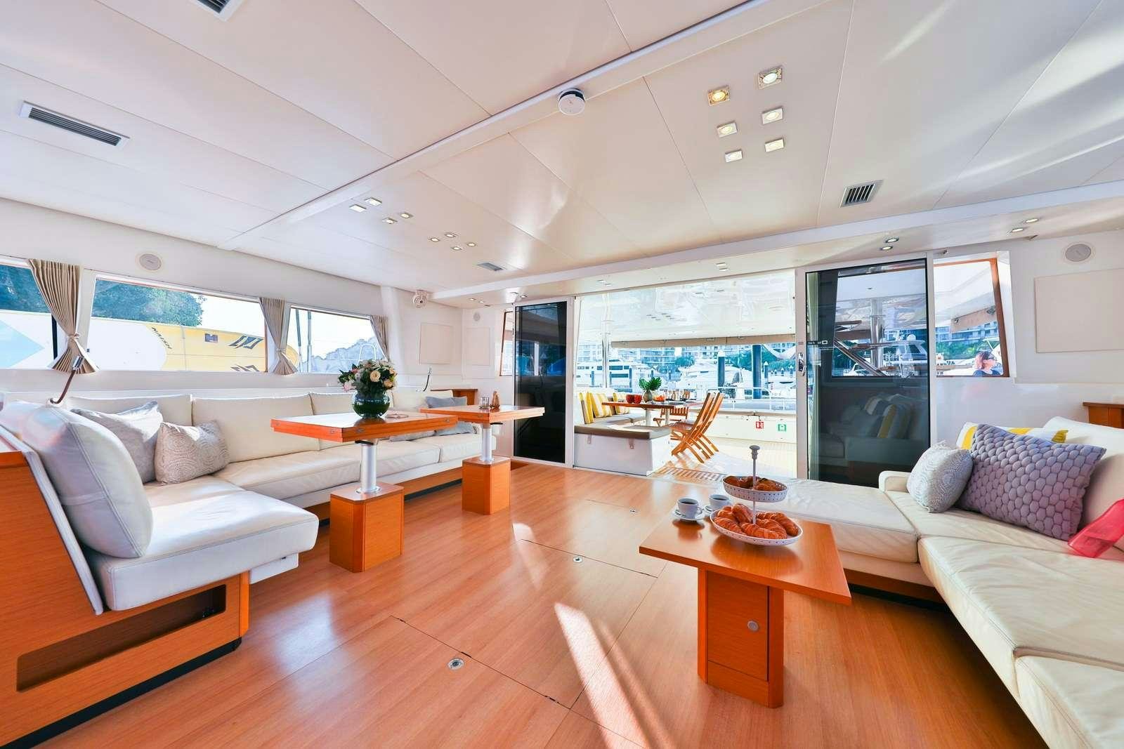a living room with a wood floor aboard JYOHANA Yacht for Charter