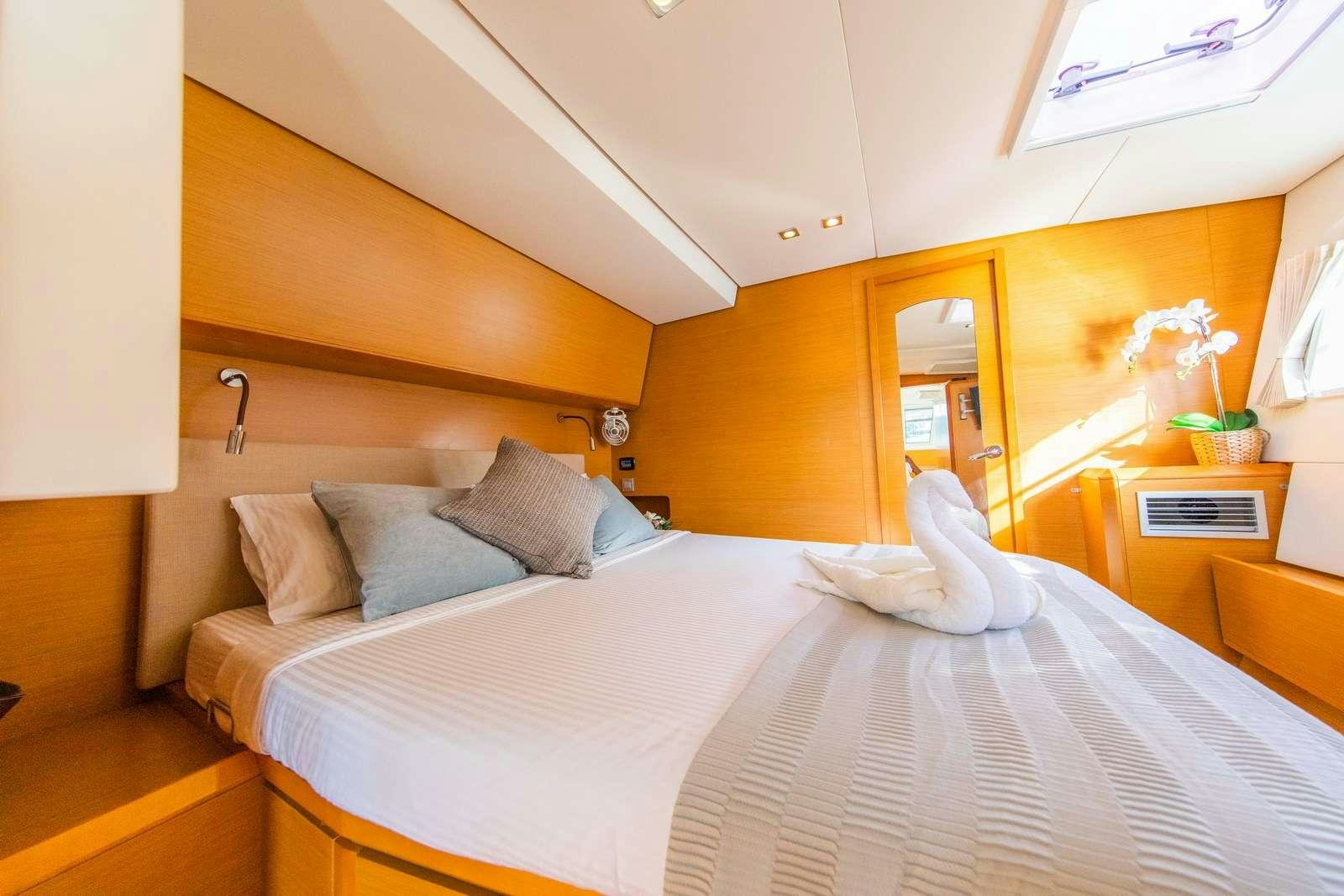 a person lying on a bed aboard JYOHANA Yacht for Charter