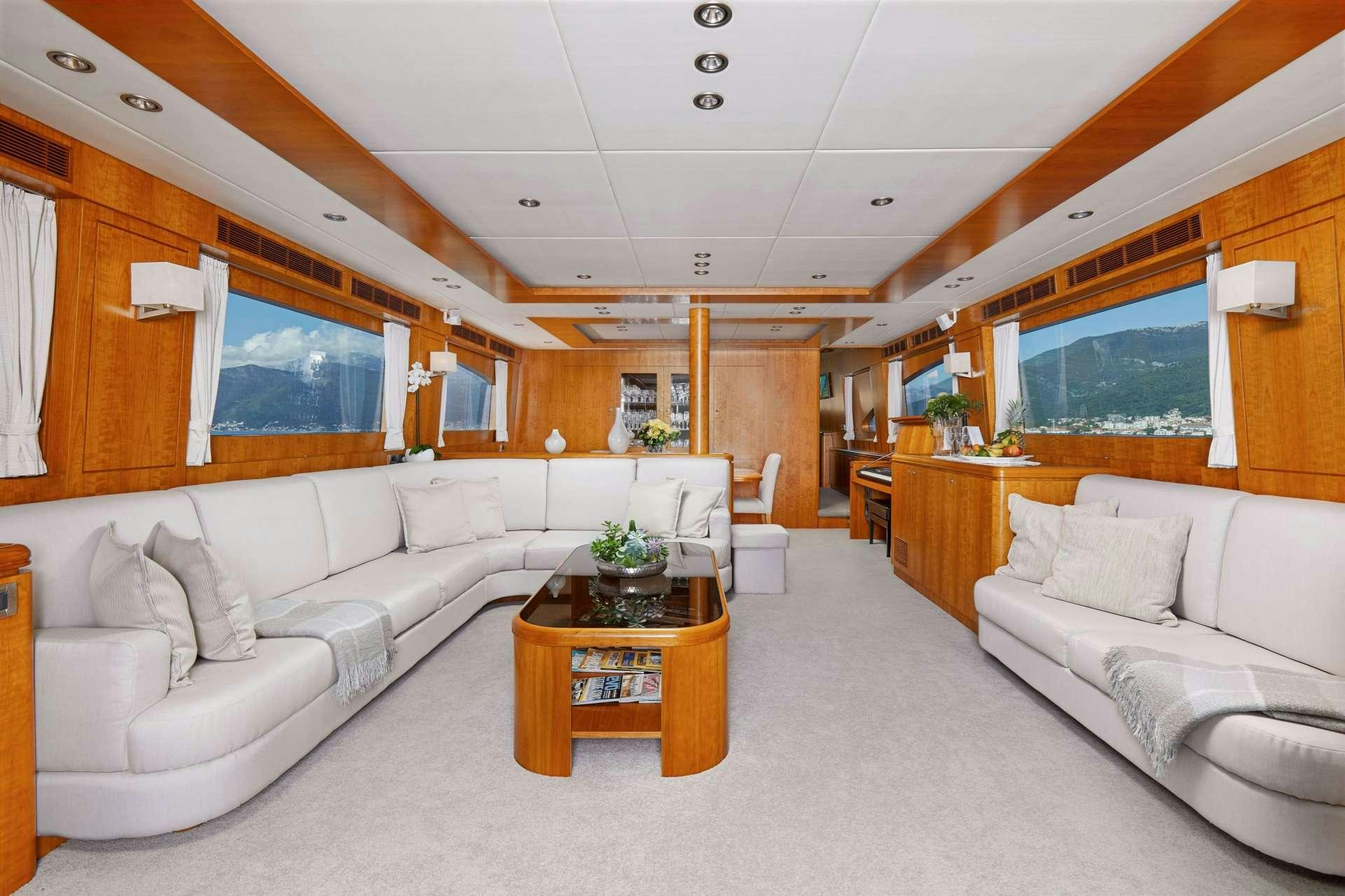 a living room with a white couch aboard ANNABEL II Yacht for Charter