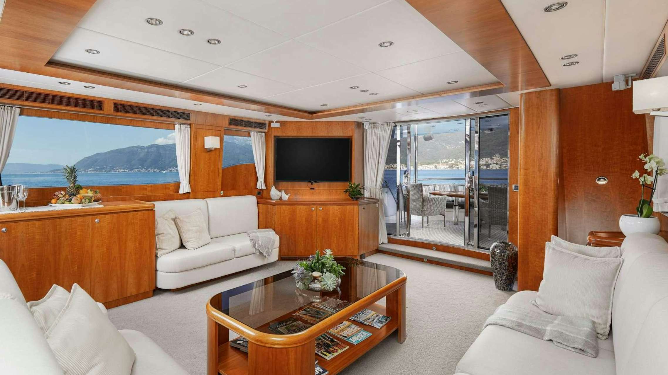 a living room with a large window aboard ANNABEL II Yacht for Charter