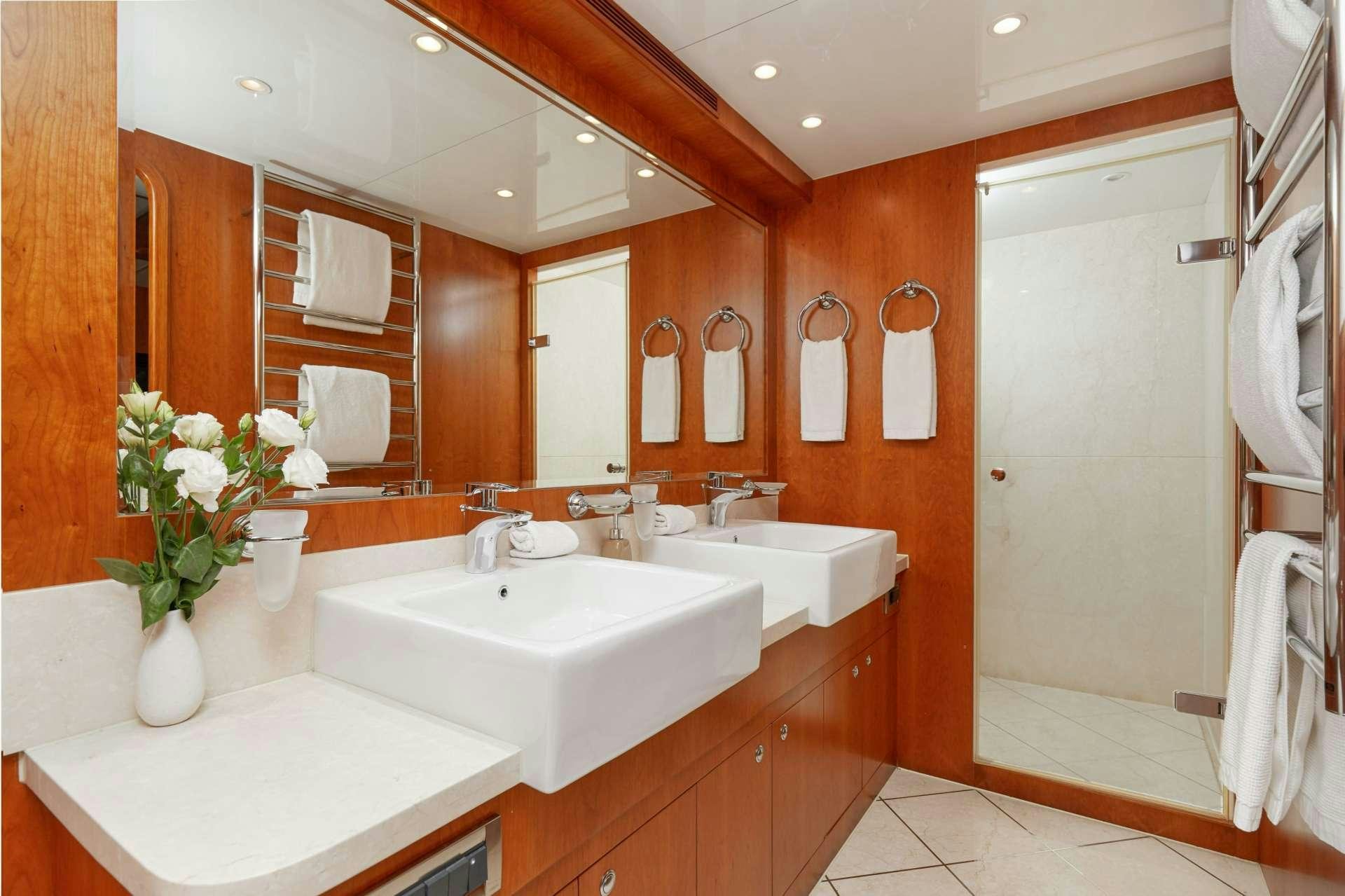 a bathroom with a large mirror aboard ANNABEL II Yacht for Charter
