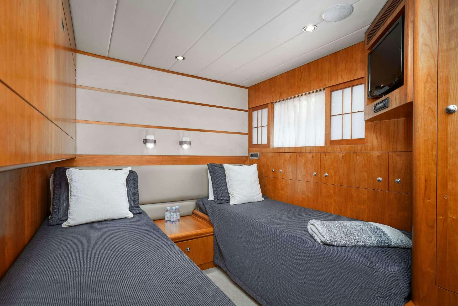 a room with two beds aboard ANNABEL II Yacht for Charter