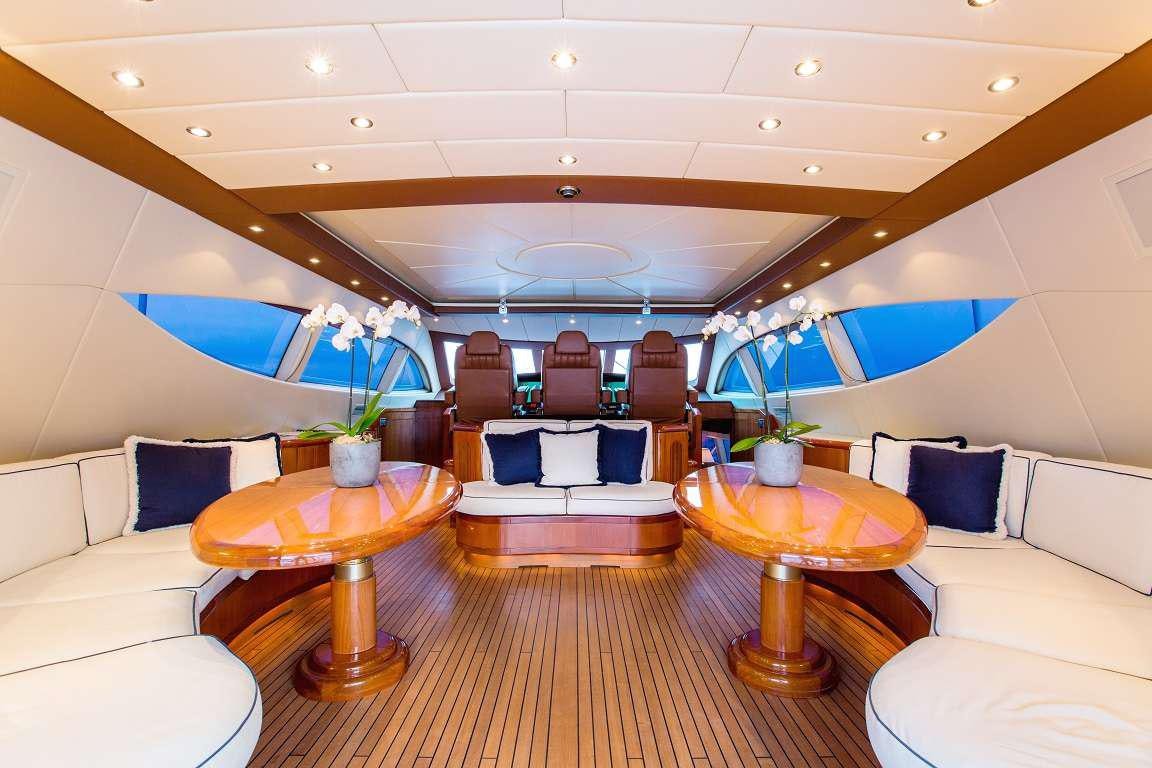 a room with a table and chairs aboard 7 KNOTS Yacht for Charter