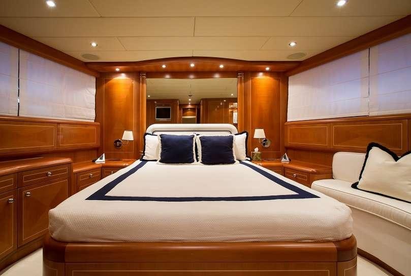 a large bedroom with a bed aboard 7 KNOTS Yacht for Charter