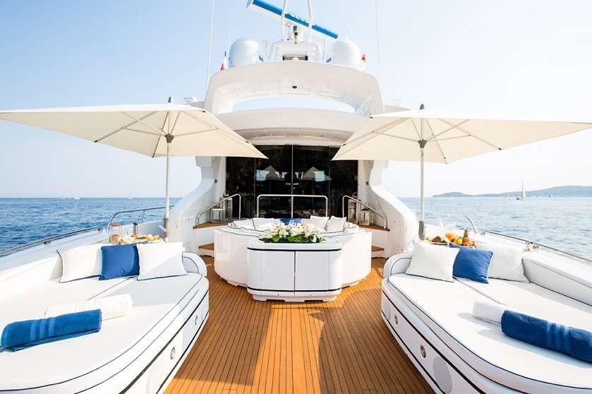 a room with a table and chairs aboard 7 KNOTS Yacht for Charter