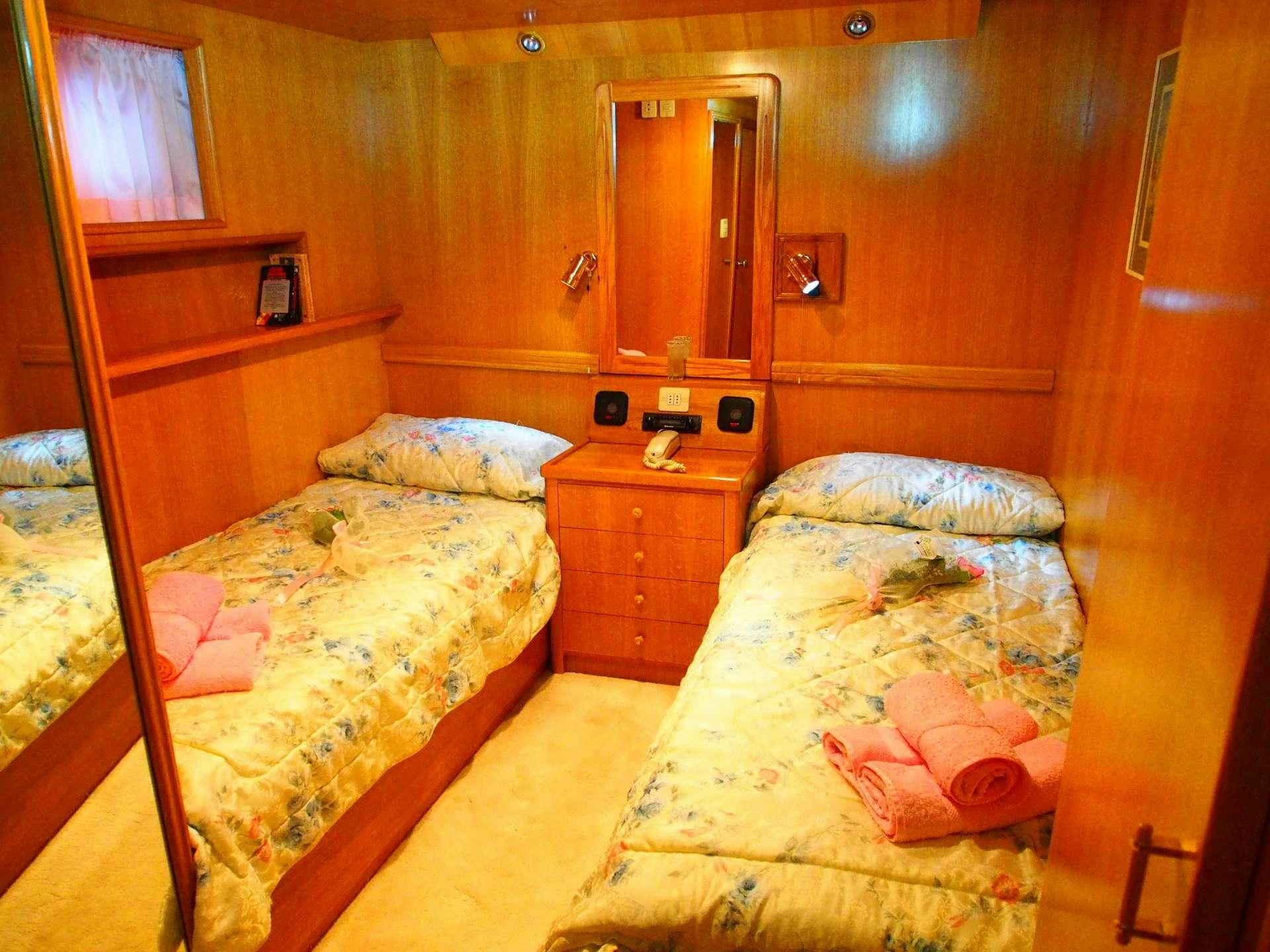 a couple of beds in a cabin aboard K Yacht for Charter