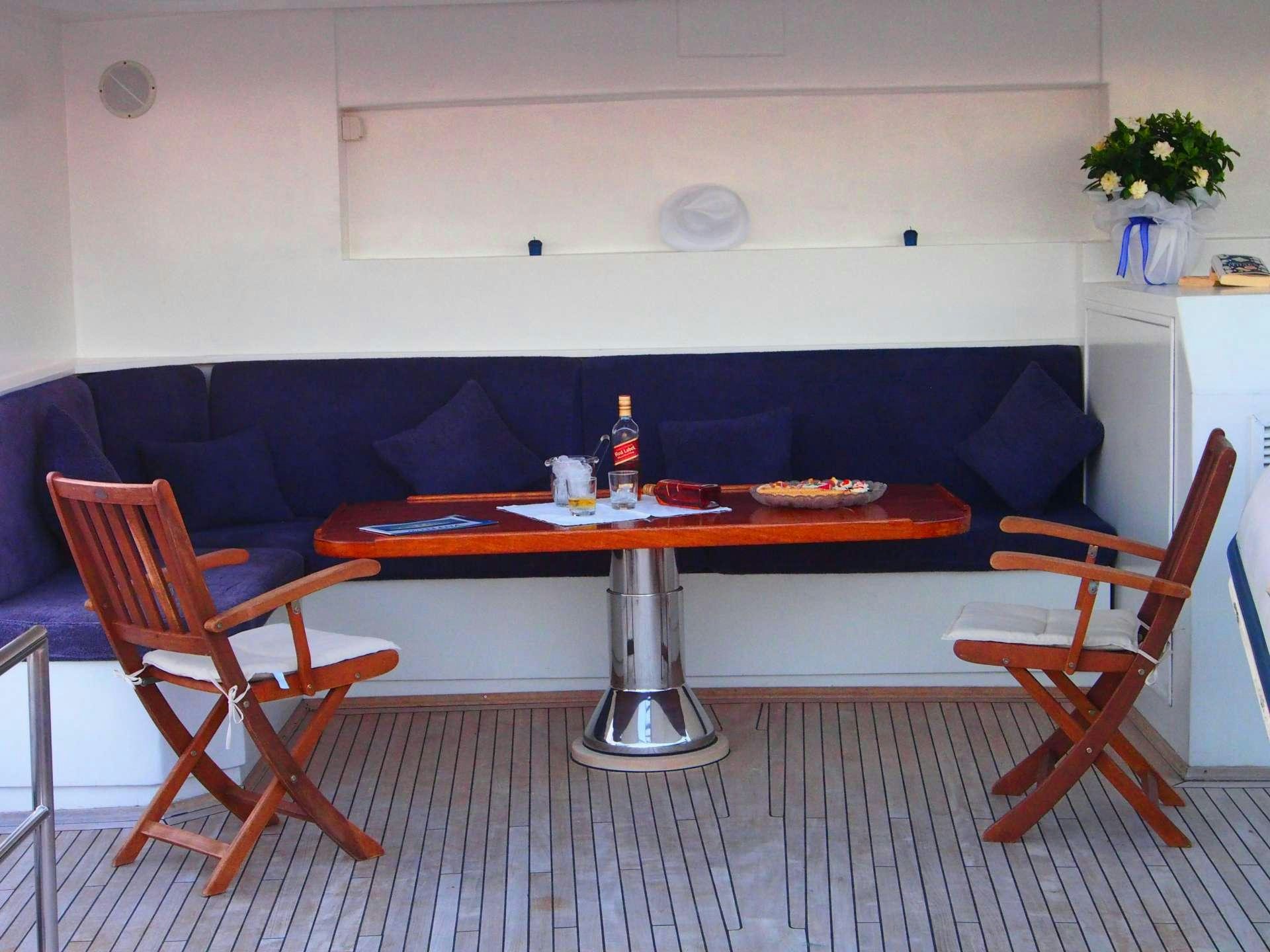a table and chairs in a room aboard K Yacht for Charter