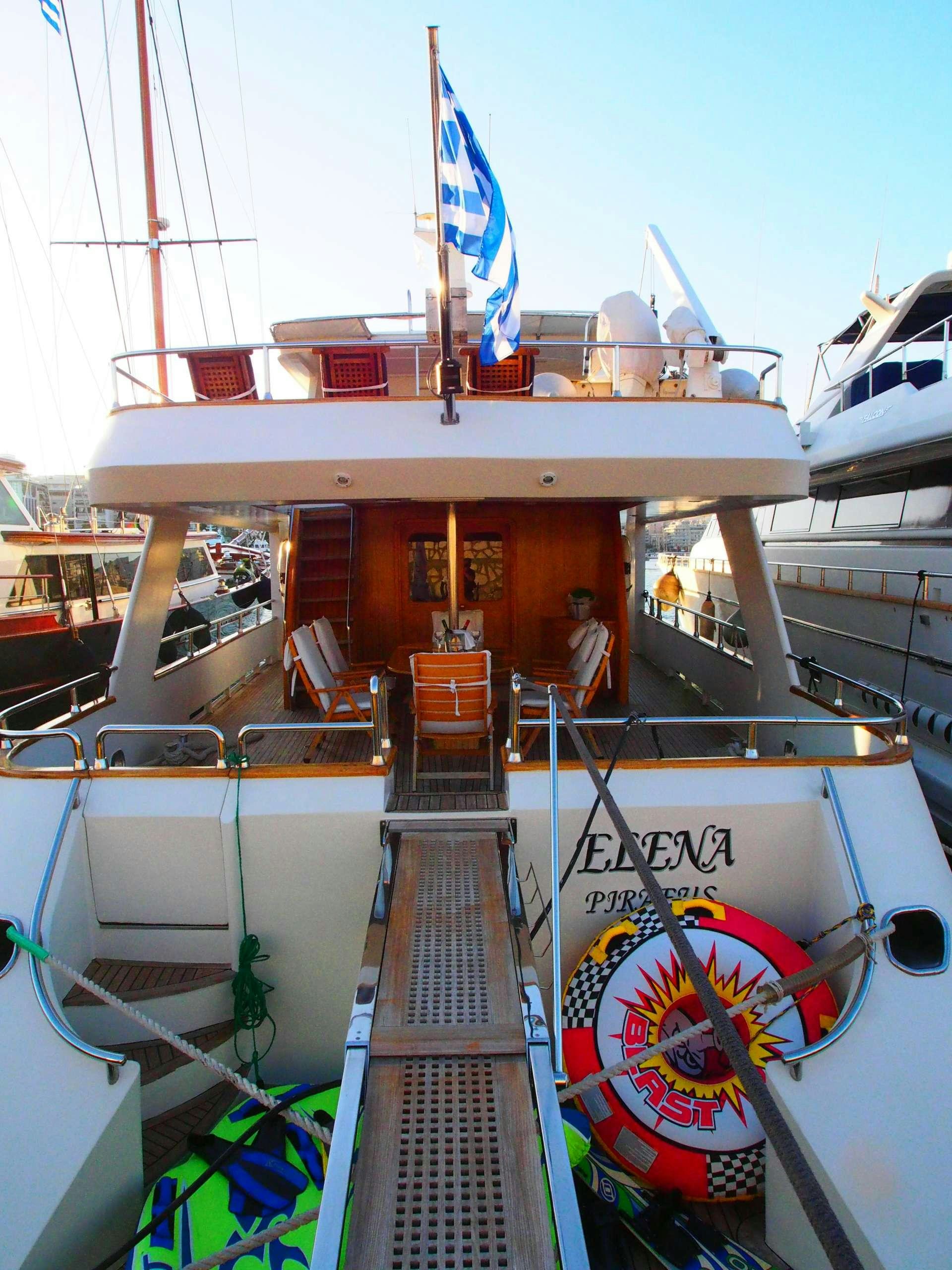 a boat with a sign on the front aboard K Yacht for Charter