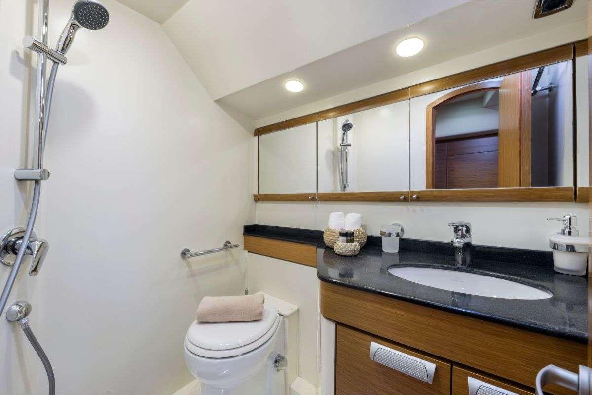 a bathroom with a sink and a toilet aboard SHOOTING STAR Yacht for Charter