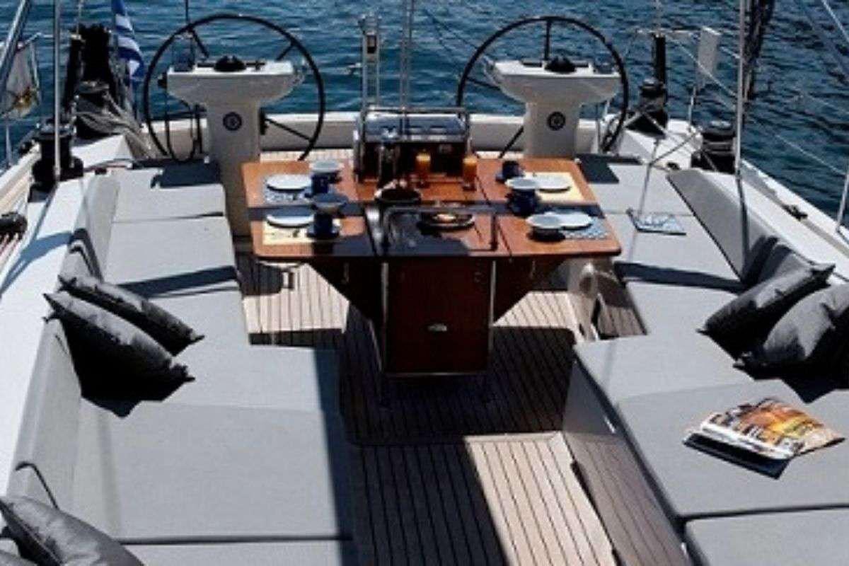 a boat with a table and chairs aboard SHOOTING STAR Yacht for Charter