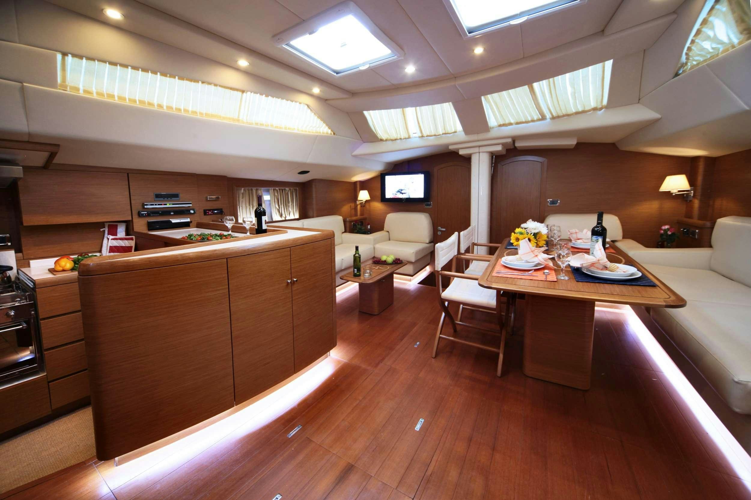 a room with a table and chairs aboard SHOOTING STAR Yacht for Charter
