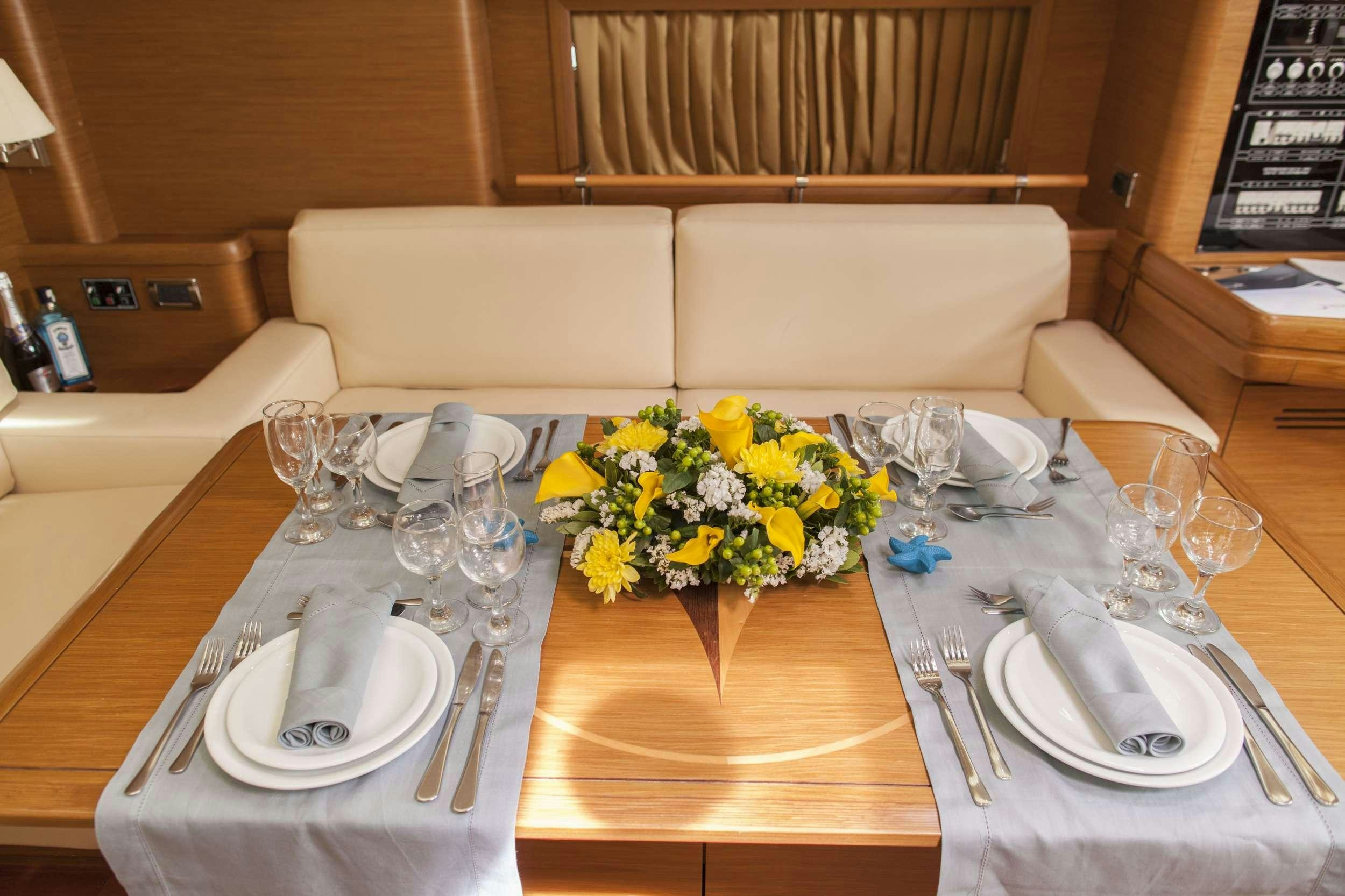 a table set with place settings aboard SHOOTING STAR Yacht for Charter