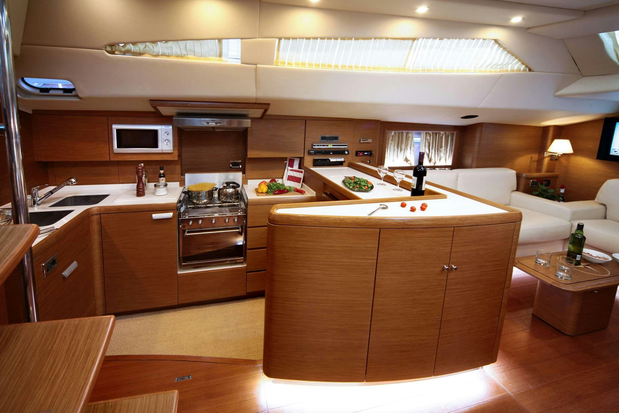a kitchen with a stove and oven aboard SHOOTING STAR Yacht for Charter