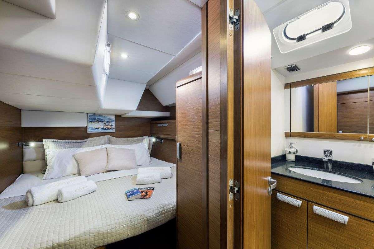 a bed in a room aboard SHOOTING STAR Yacht for Charter