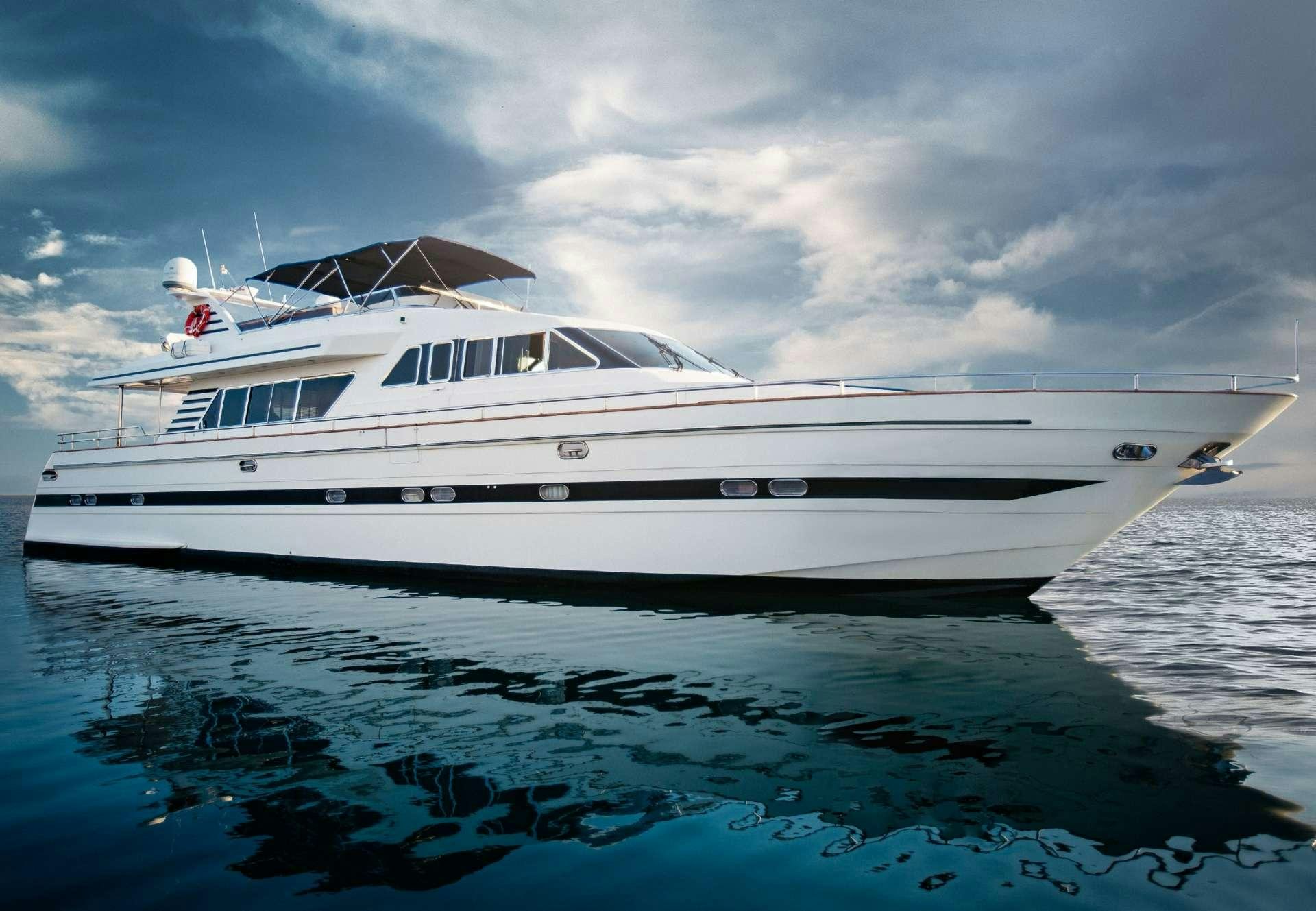 a white boat in the water aboard DREAM Yacht for Charter
