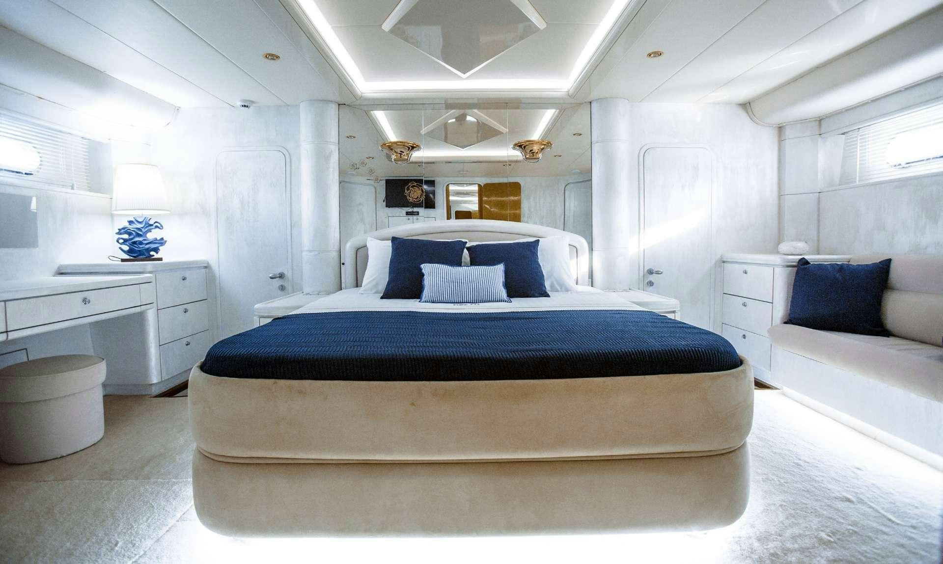 a large bedroom with a bed aboard DREAM Yacht for Charter