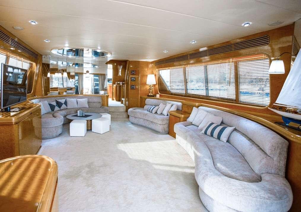 a large living room with a large window aboard DREAM Yacht for Charter