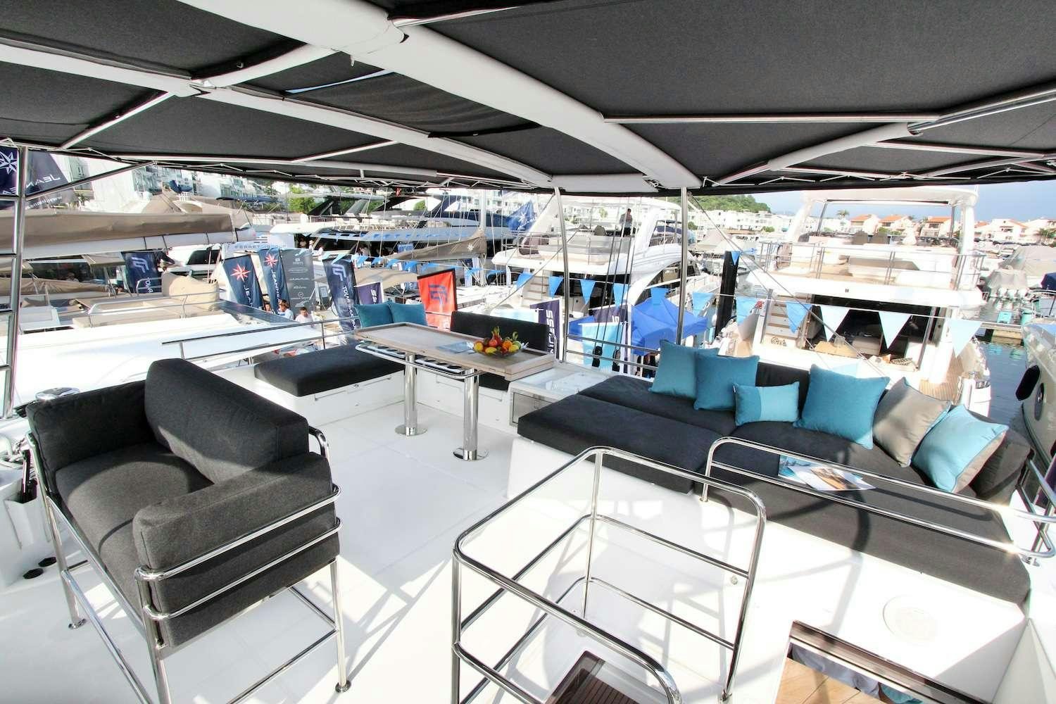 inside of a large room with a table and chairs aboard ELLEN SOPHIA Yacht for Charter