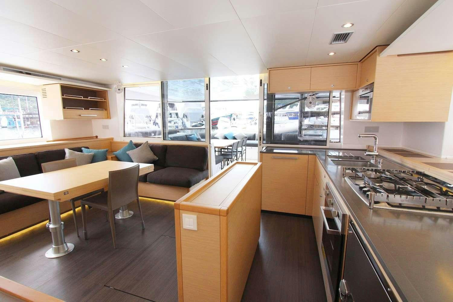 a kitchen with a stove and a table aboard ELLEN SOPHIA Yacht for Charter