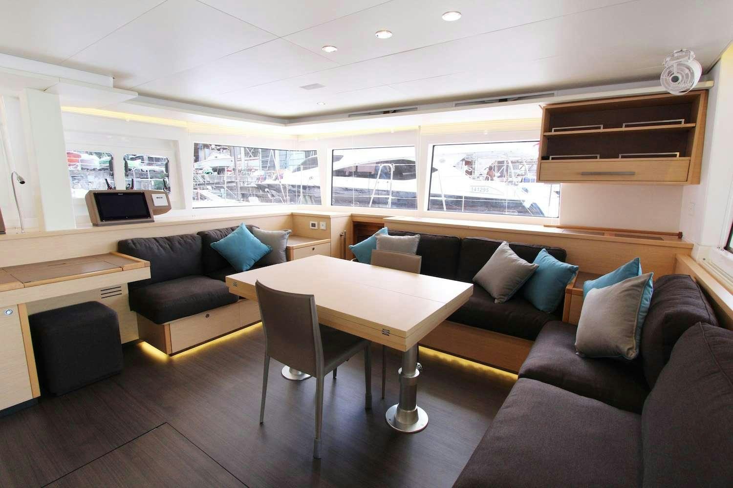 a living room with a couch and a table aboard ELLEN SOPHIA Yacht for Charter