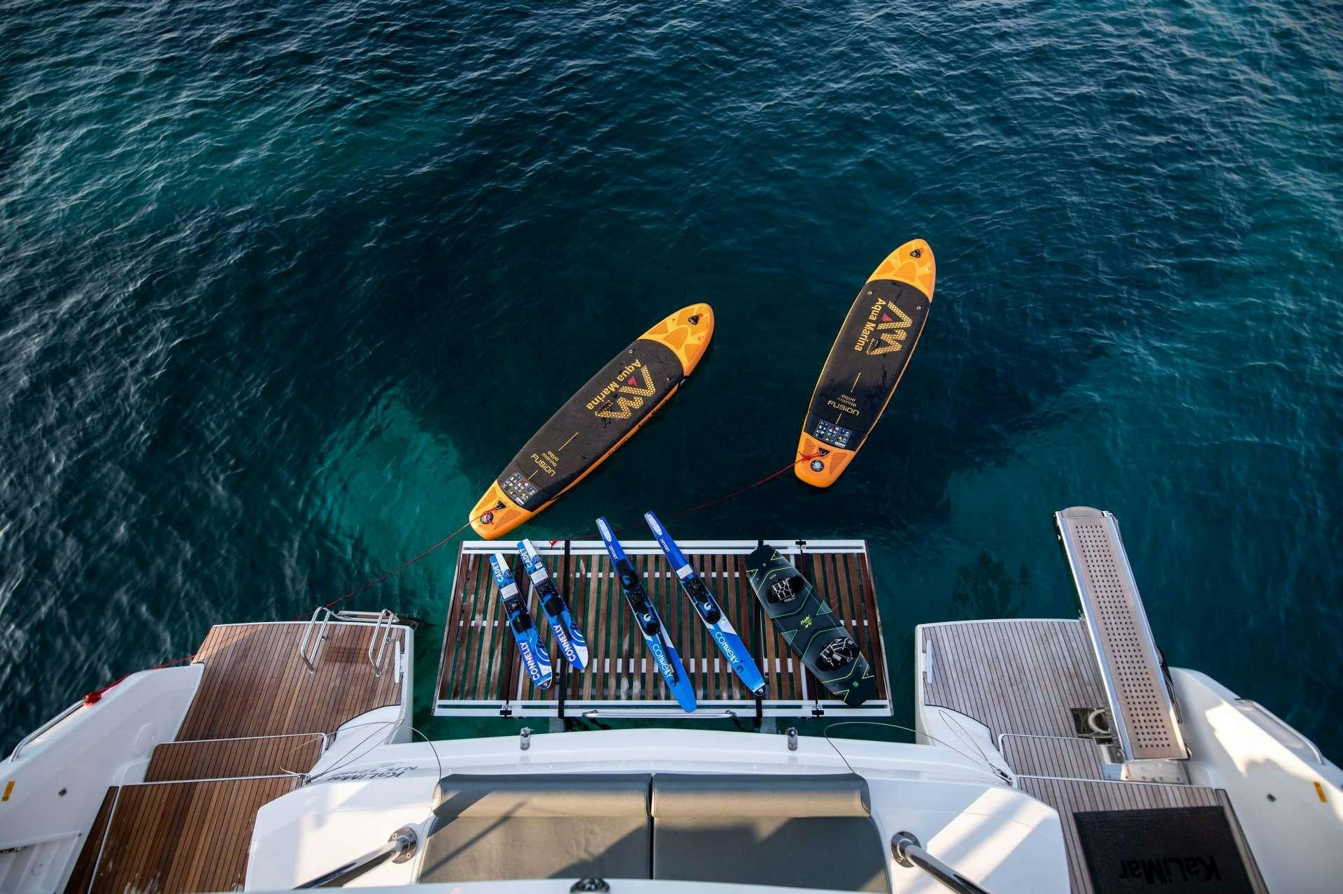 a boat with paddles on the water aboard KaLiMar Yacht for Charter