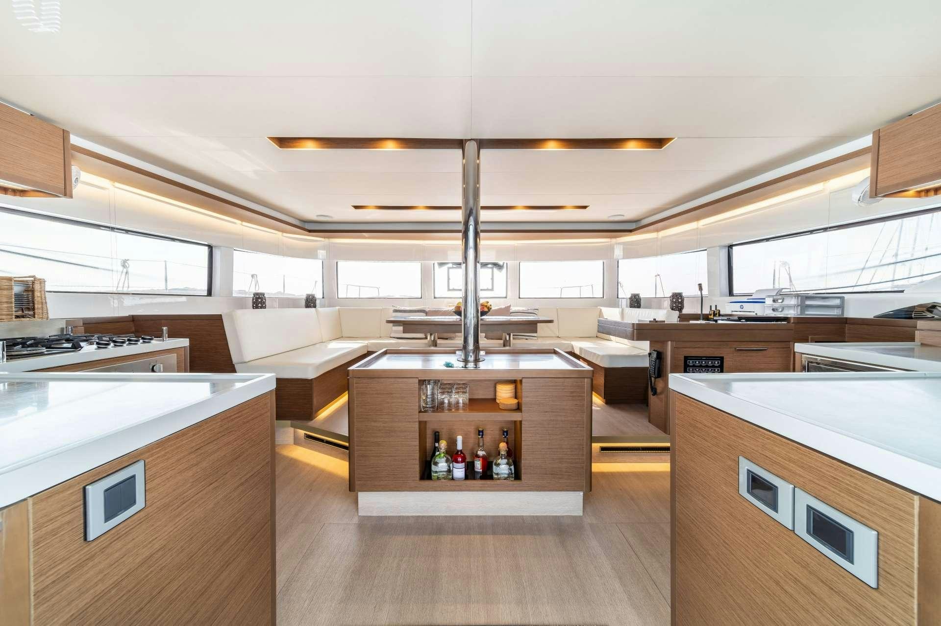 a room with a ceiling fan aboard KaLiMar Yacht for Charter