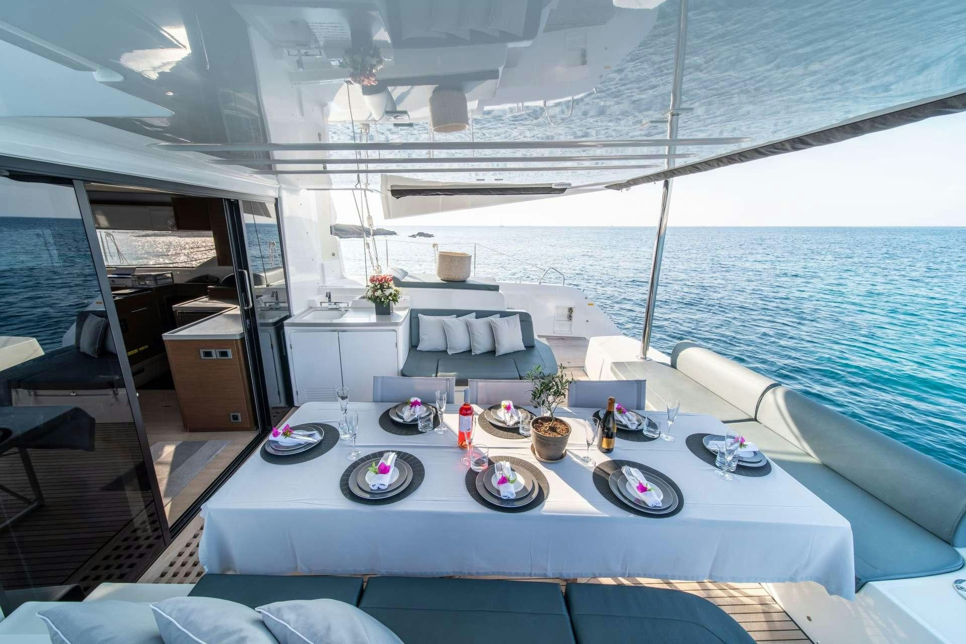 a large lounge area with a large pool and a large deck aboard KaLiMar Yacht for Charter