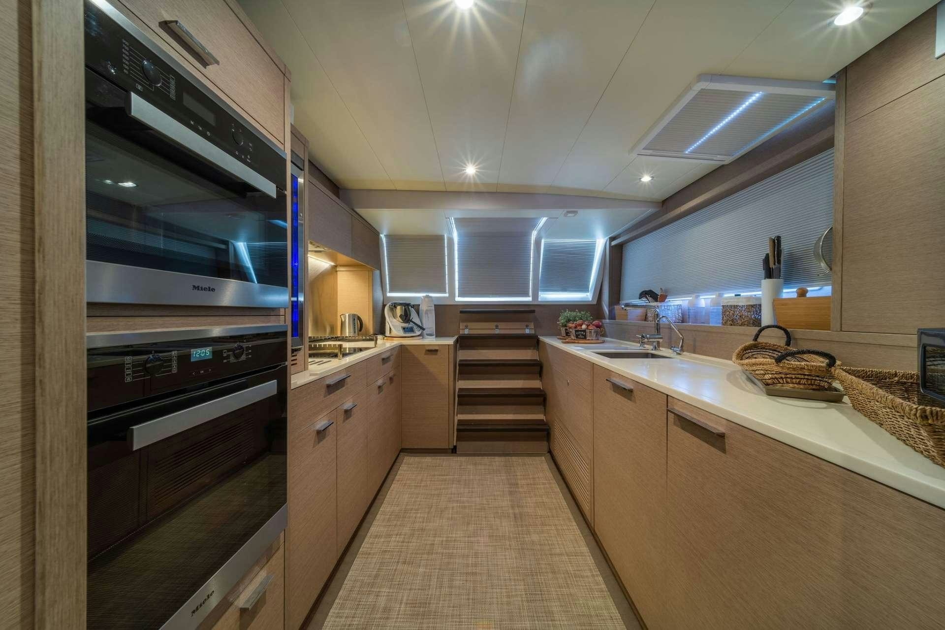 a kitchen with a stove and oven aboard JUST MARIE Yacht for Charter