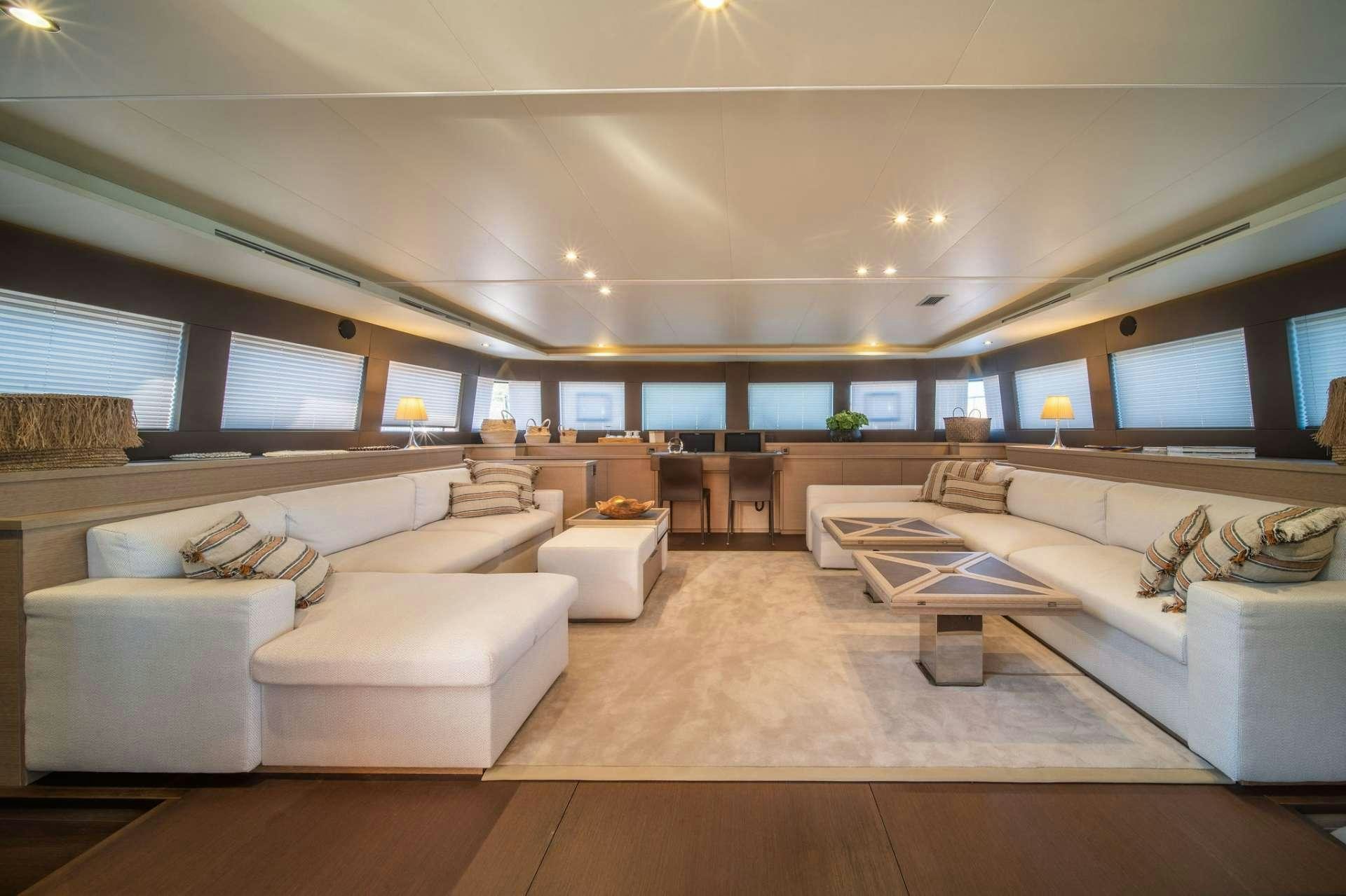 a living room with a large screen aboard JUST MARIE Yacht for Charter