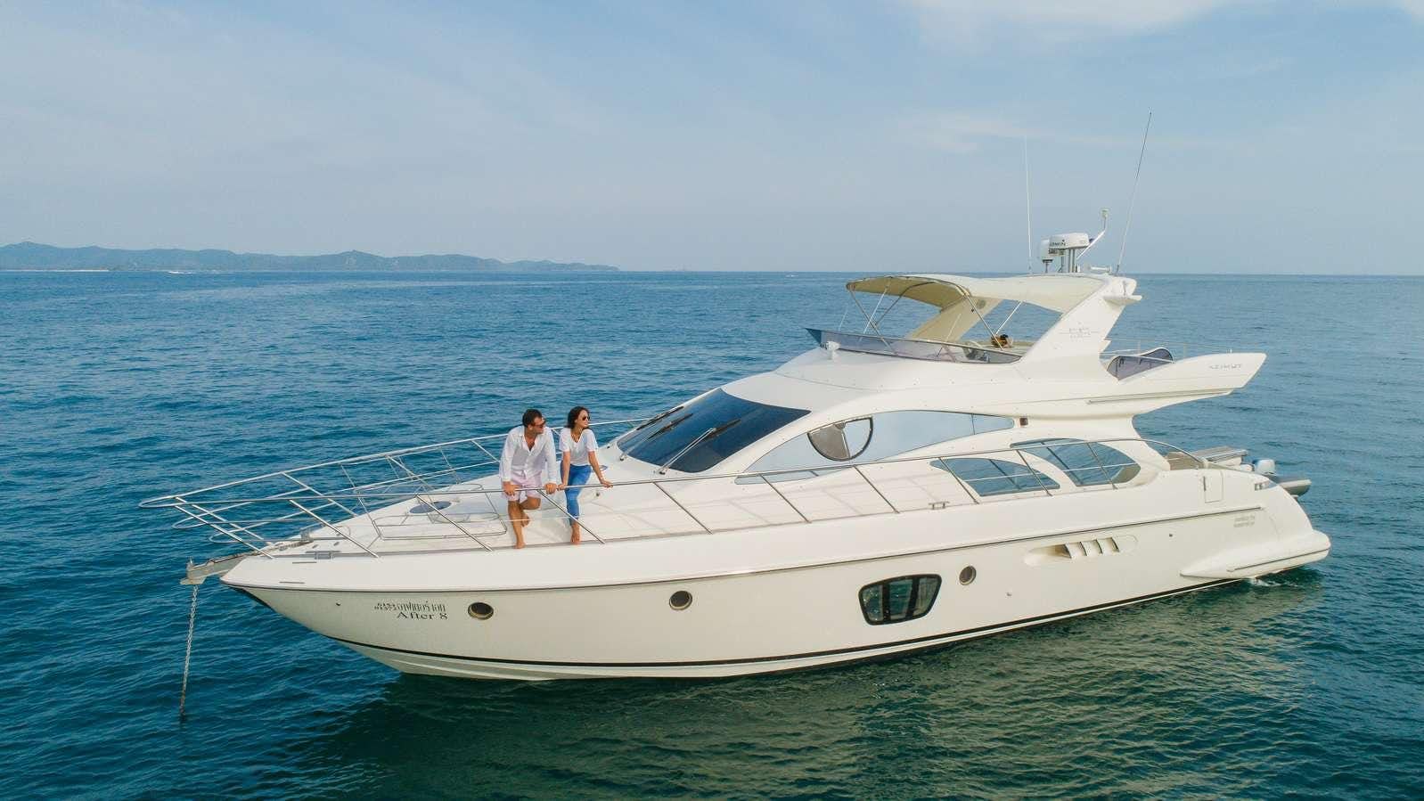 two people standing on a boat aboard AFTER 8 Yacht for Charter
