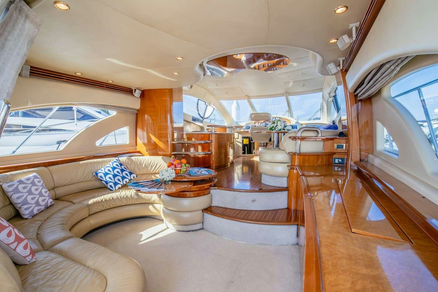 a large living room with a large open window aboard AFTER 8 Yacht for Charter