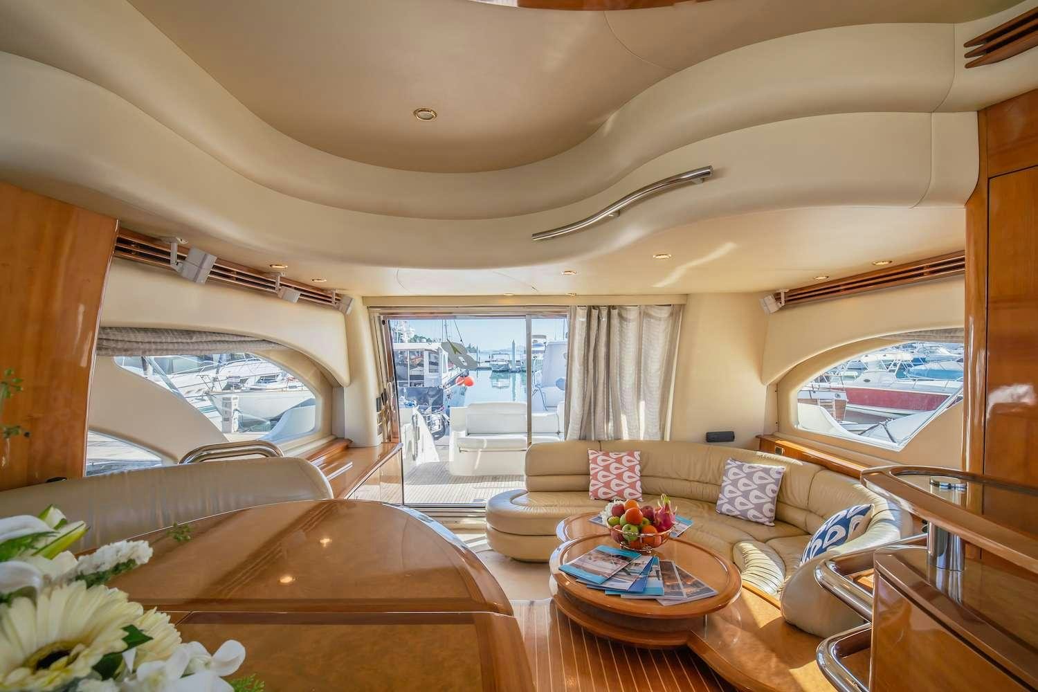 a living room with a large window aboard AFTER 8 Yacht for Charter