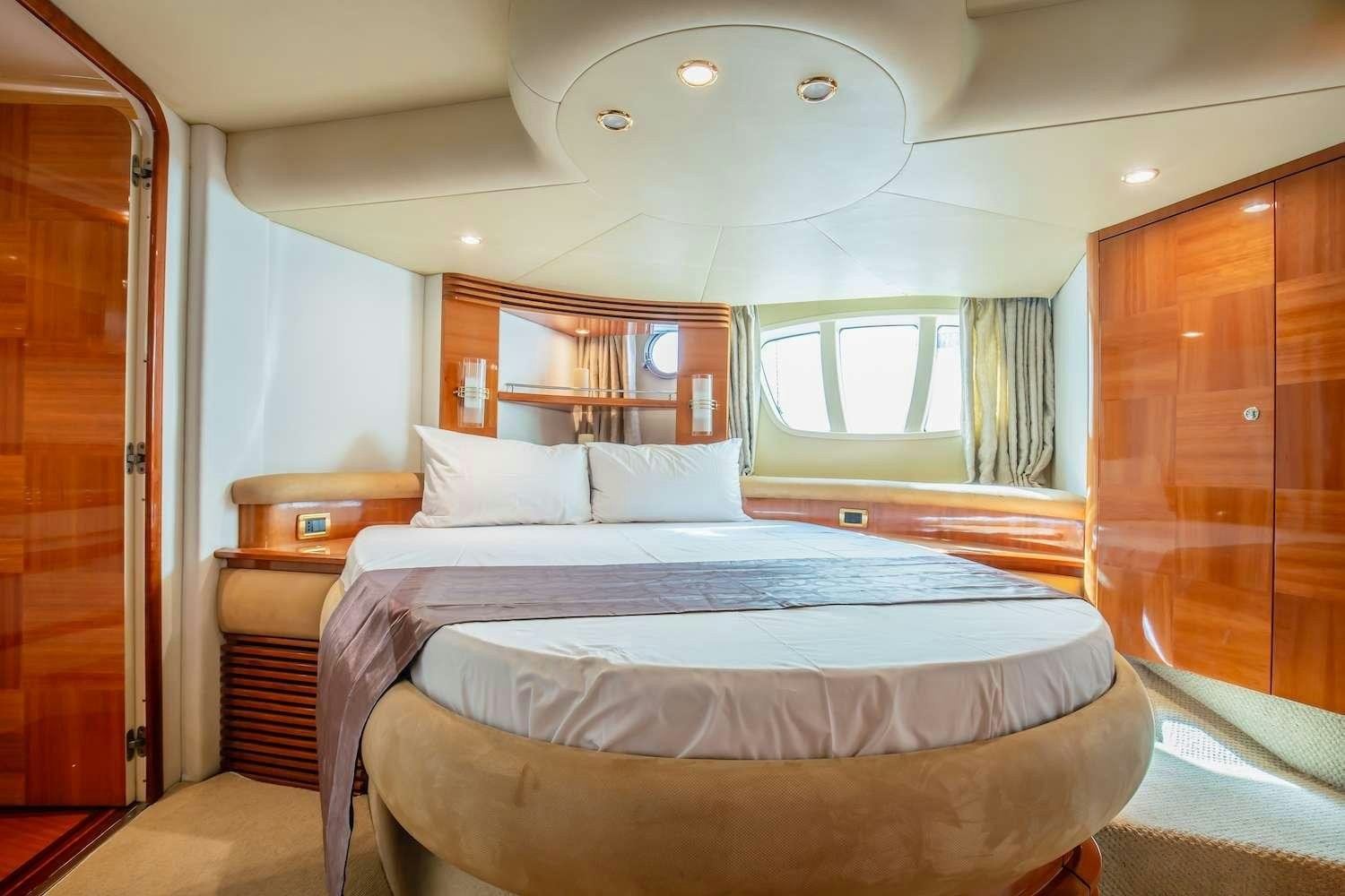 a bedroom with a bed and a closet aboard AFTER 8 Yacht for Charter