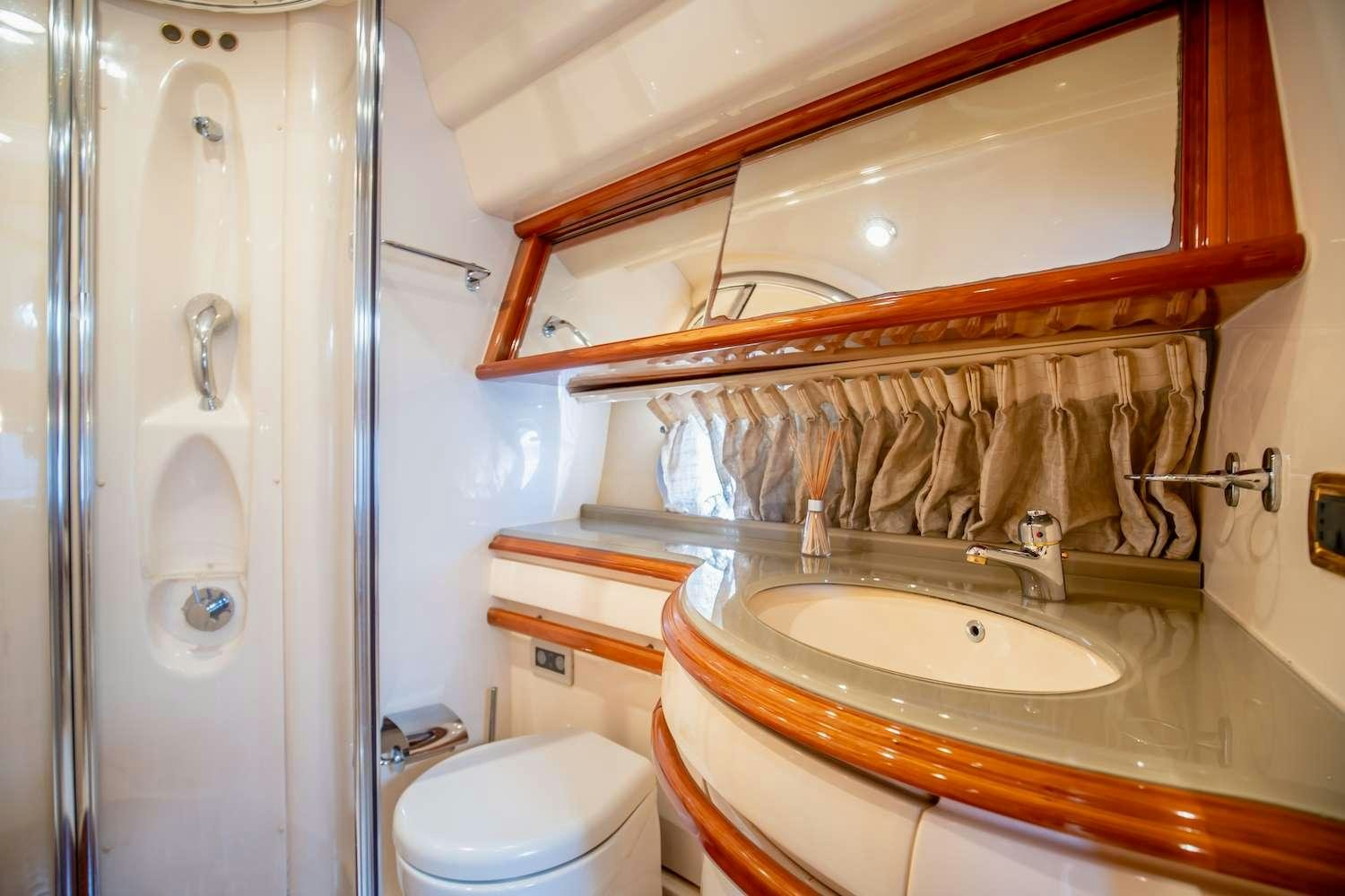 a bathroom with a sink and a toilet aboard AFTER 8 Yacht for Charter