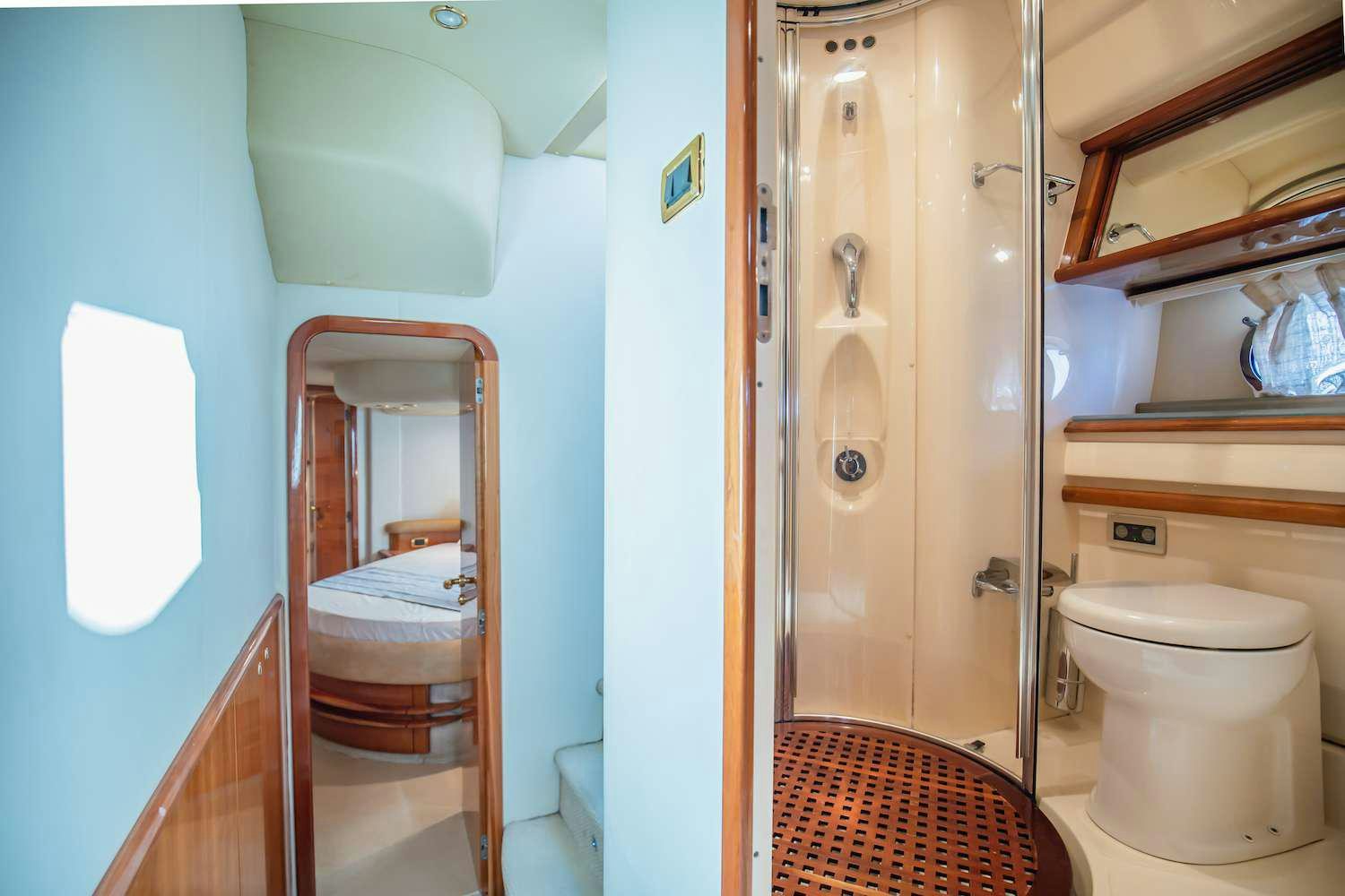 a bathroom with a toilet and a sink aboard AFTER 8 Yacht for Charter
