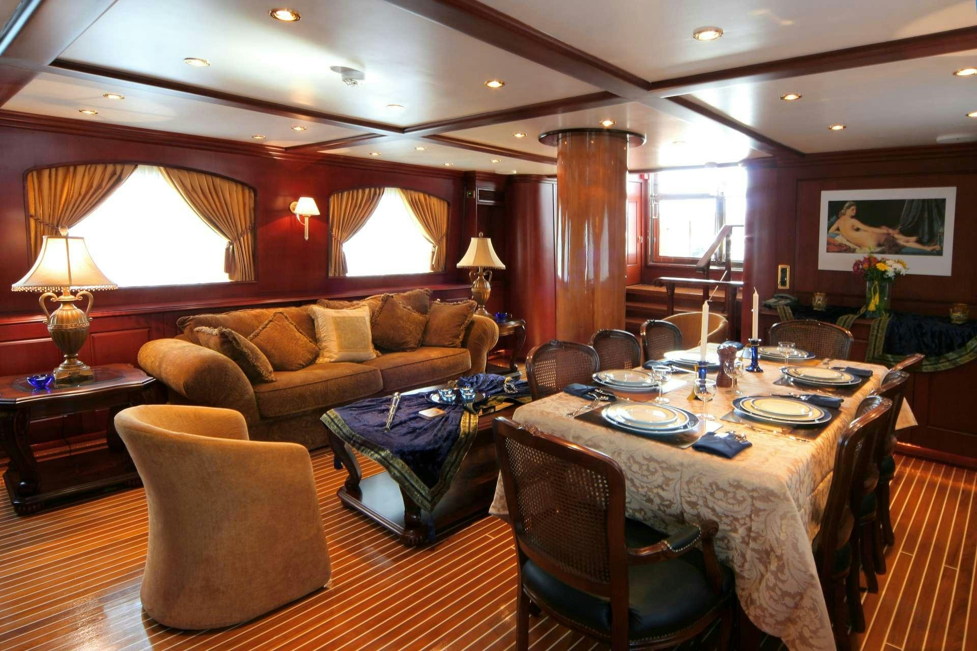 a dining room with a large table aboard BLUE DREAM Yacht for Charter