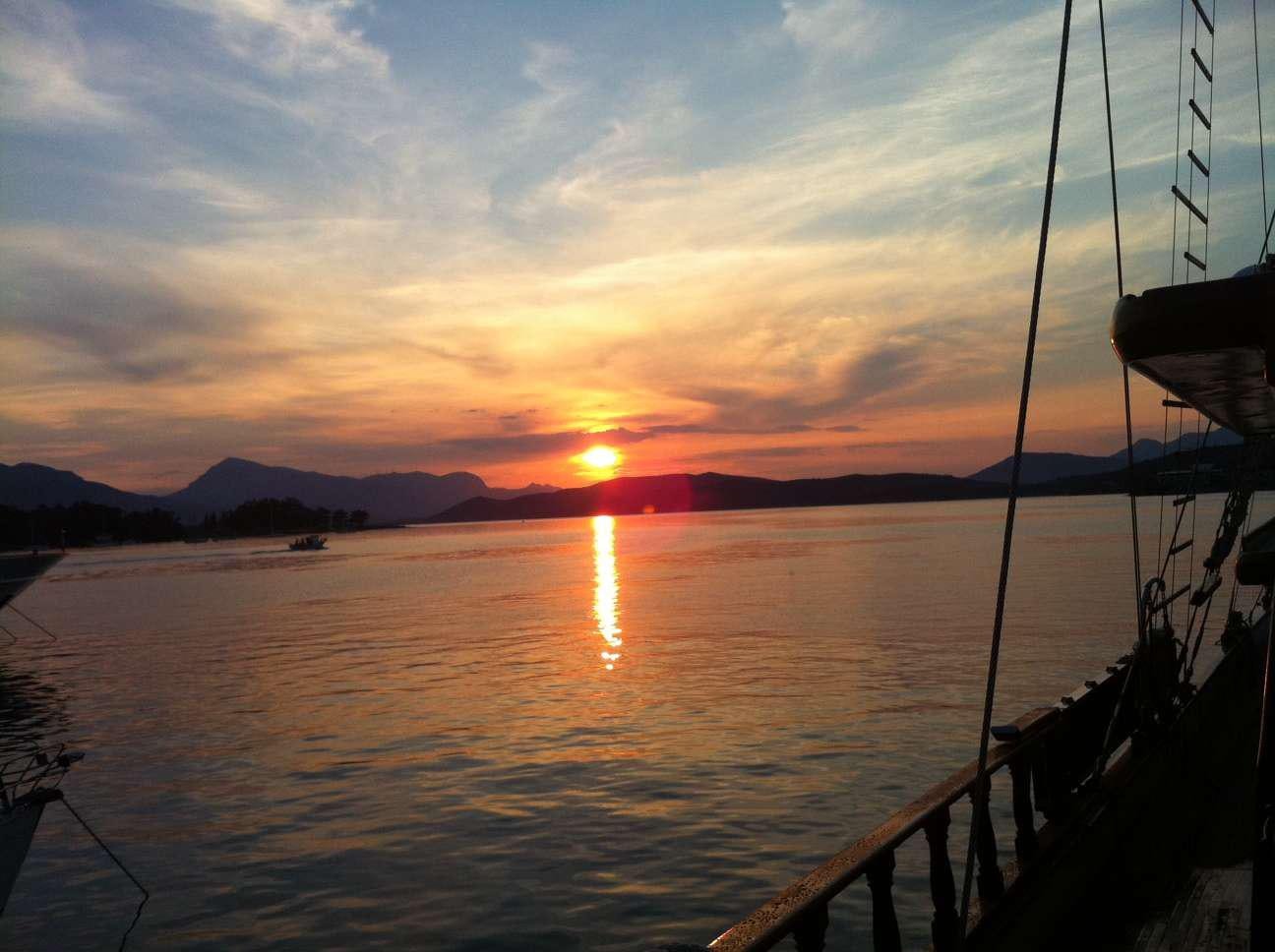 a sunset over a body of water aboard BLUE DREAM Yacht for Charter
