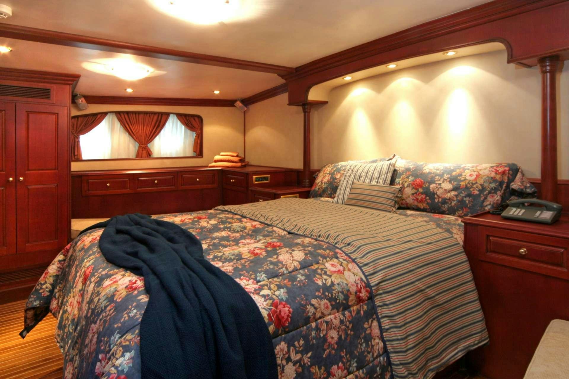 a couple of beds in a hotel room aboard BLUE DREAM Yacht for Charter