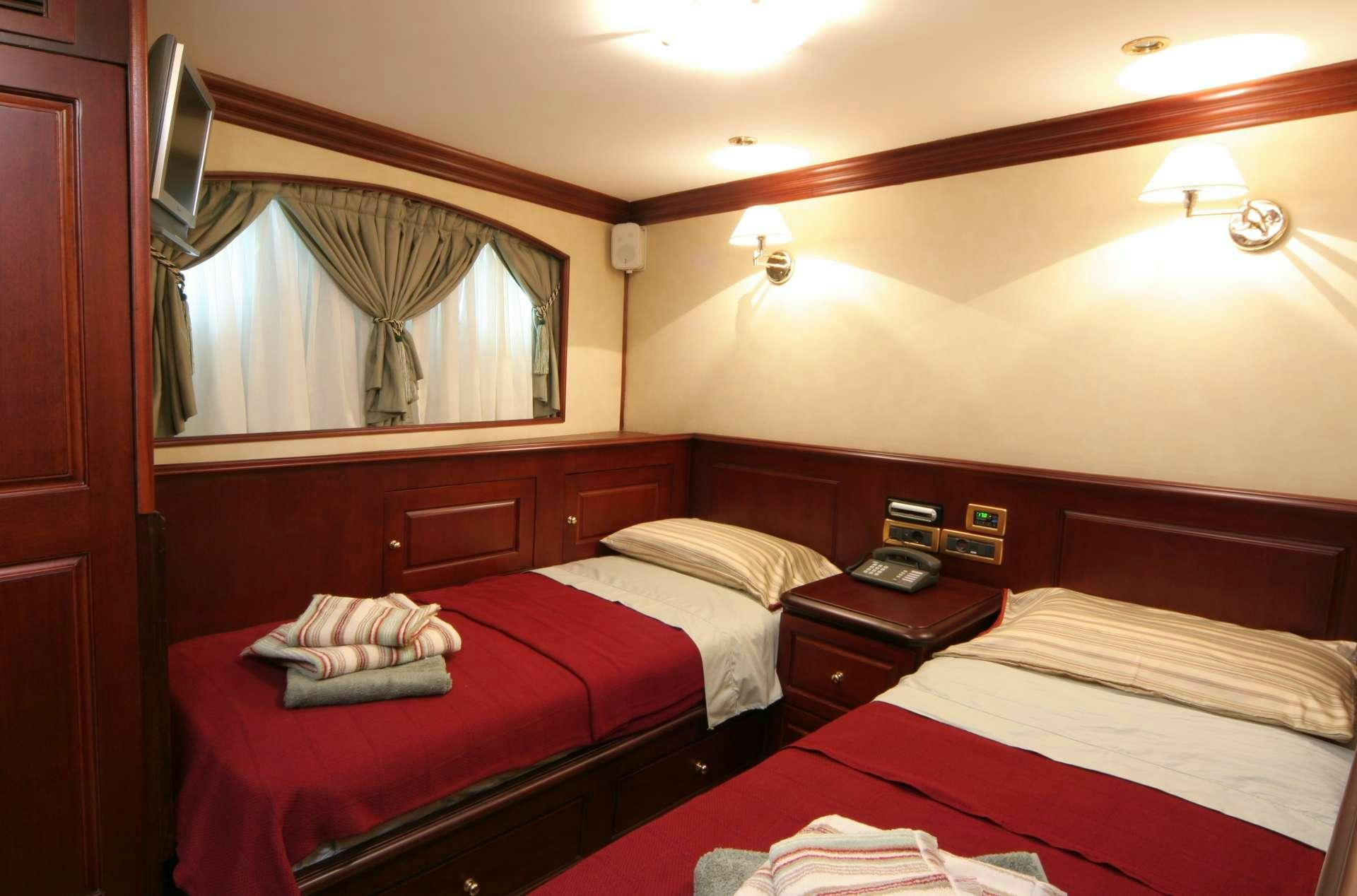 a couple of beds in a room aboard BLUE DREAM Yacht for Charter