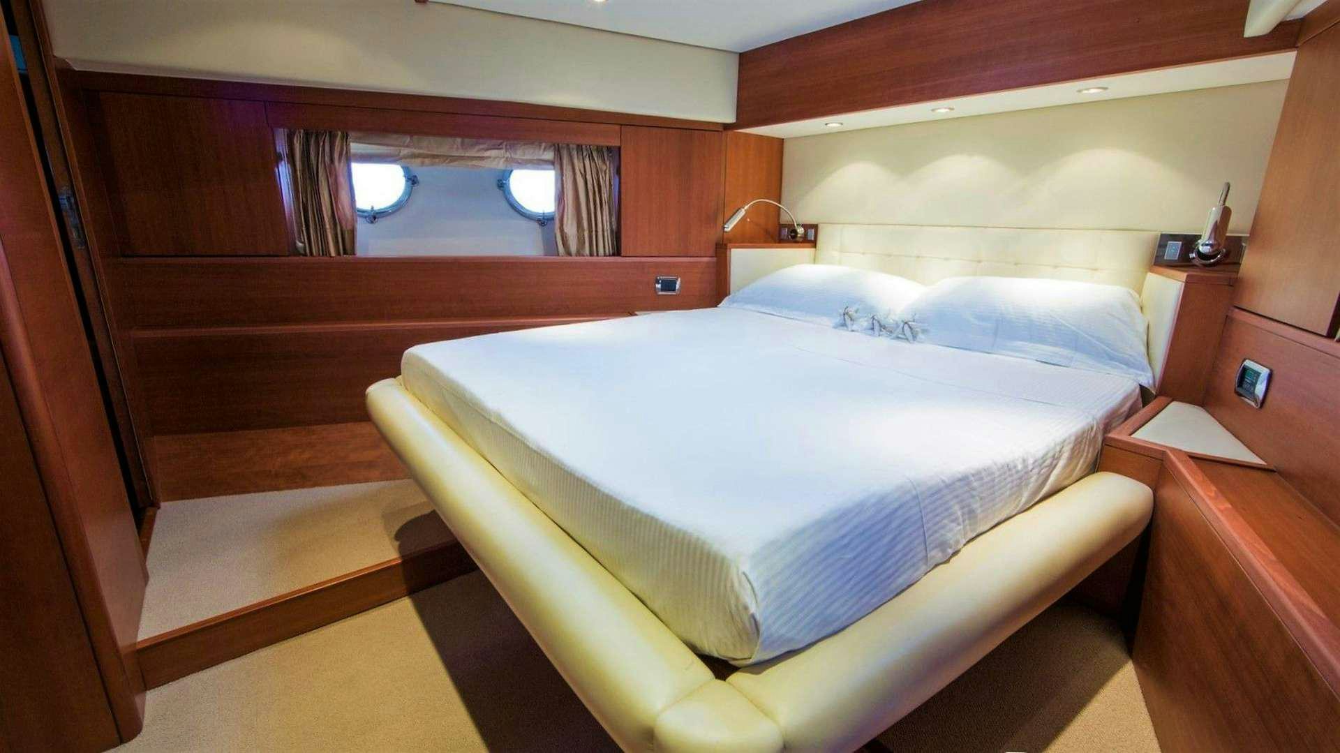 a bed in a room aboard QUESTA E VITA Yacht for Charter