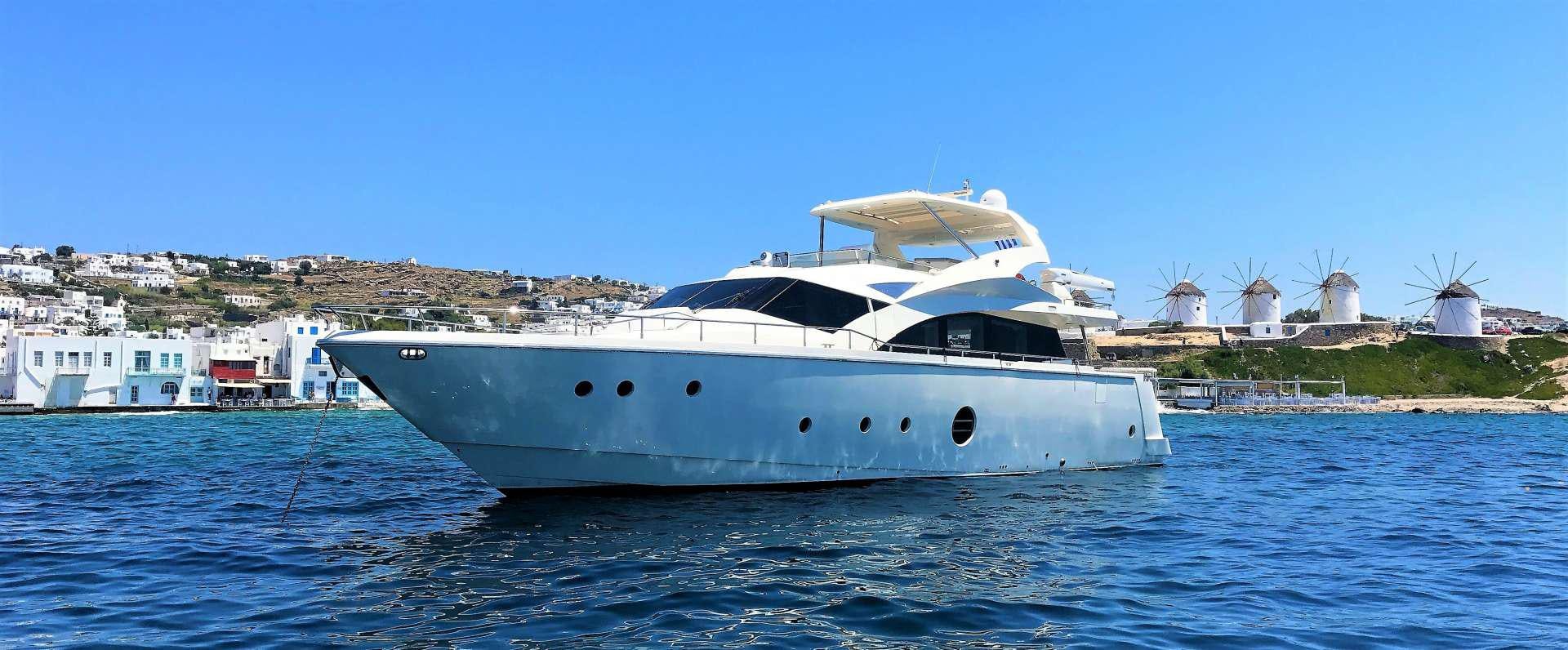 a white yacht on the water aboard QUESTA E VITA Yacht for Charter