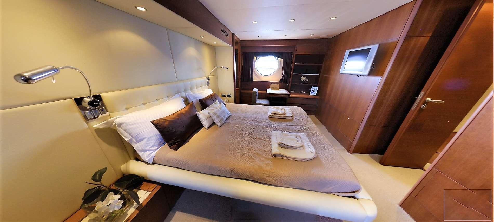 a bed in a room aboard QUESTA E VITA Yacht for Charter