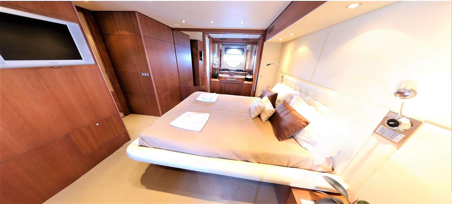 a hotel room with a bed aboard QUESTA E VITA Yacht for Charter