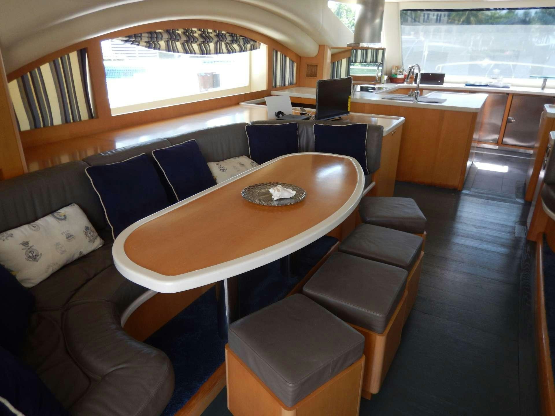 a dining table in a train aboard MAGIC STAR Yacht for Charter