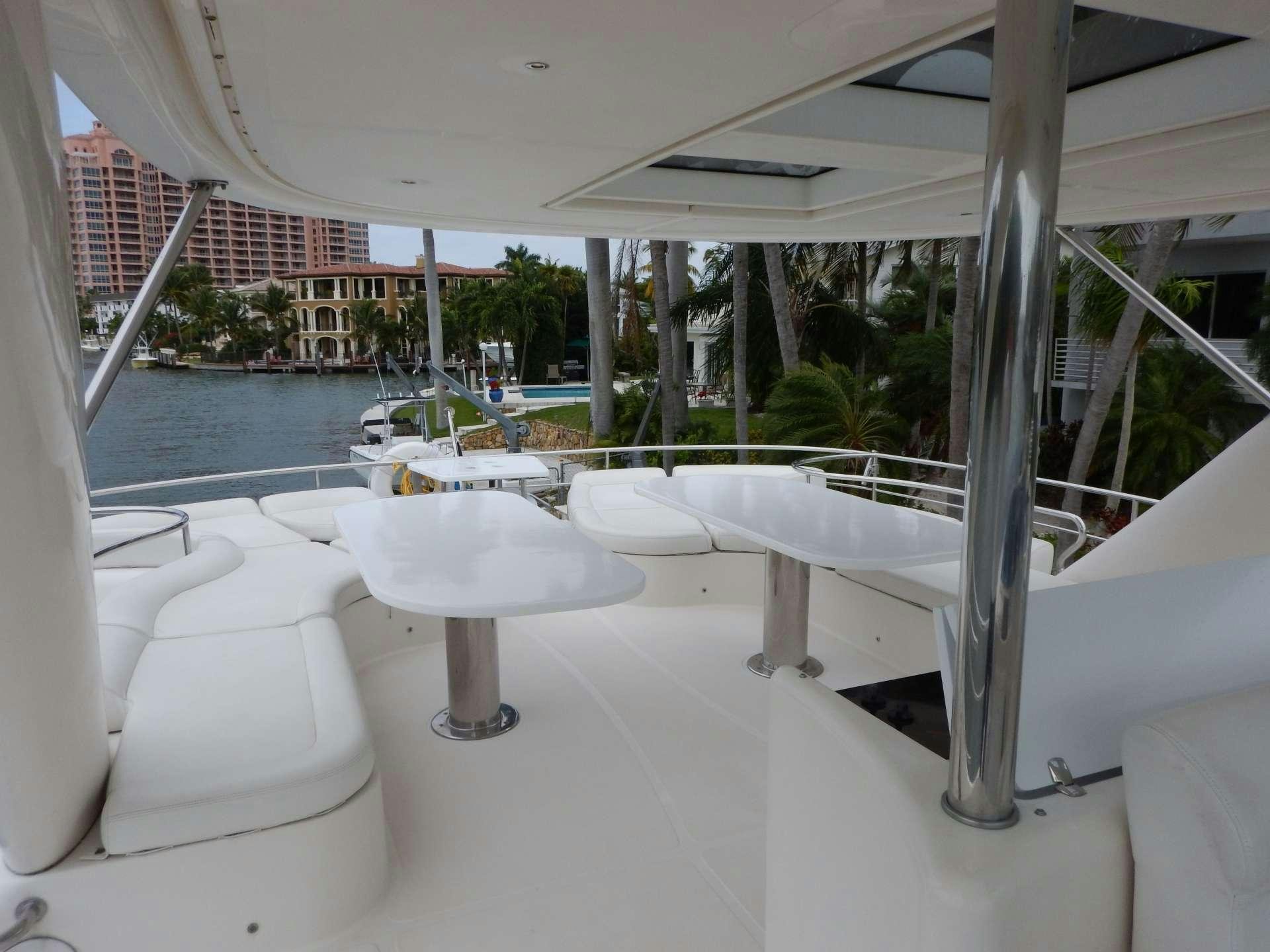 a white table on a balcony aboard MAGIC STAR Yacht for Charter