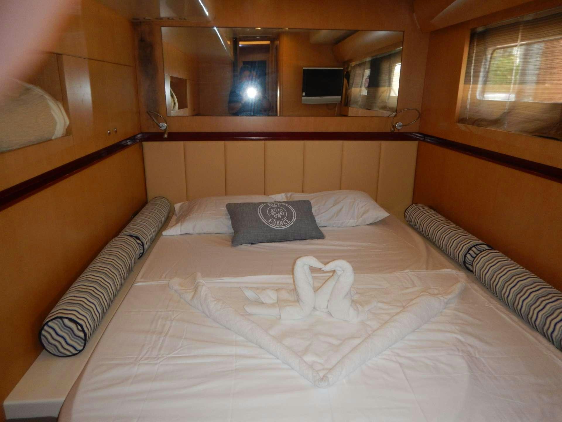 a bed with pillows aboard MAGIC STAR Yacht for Charter