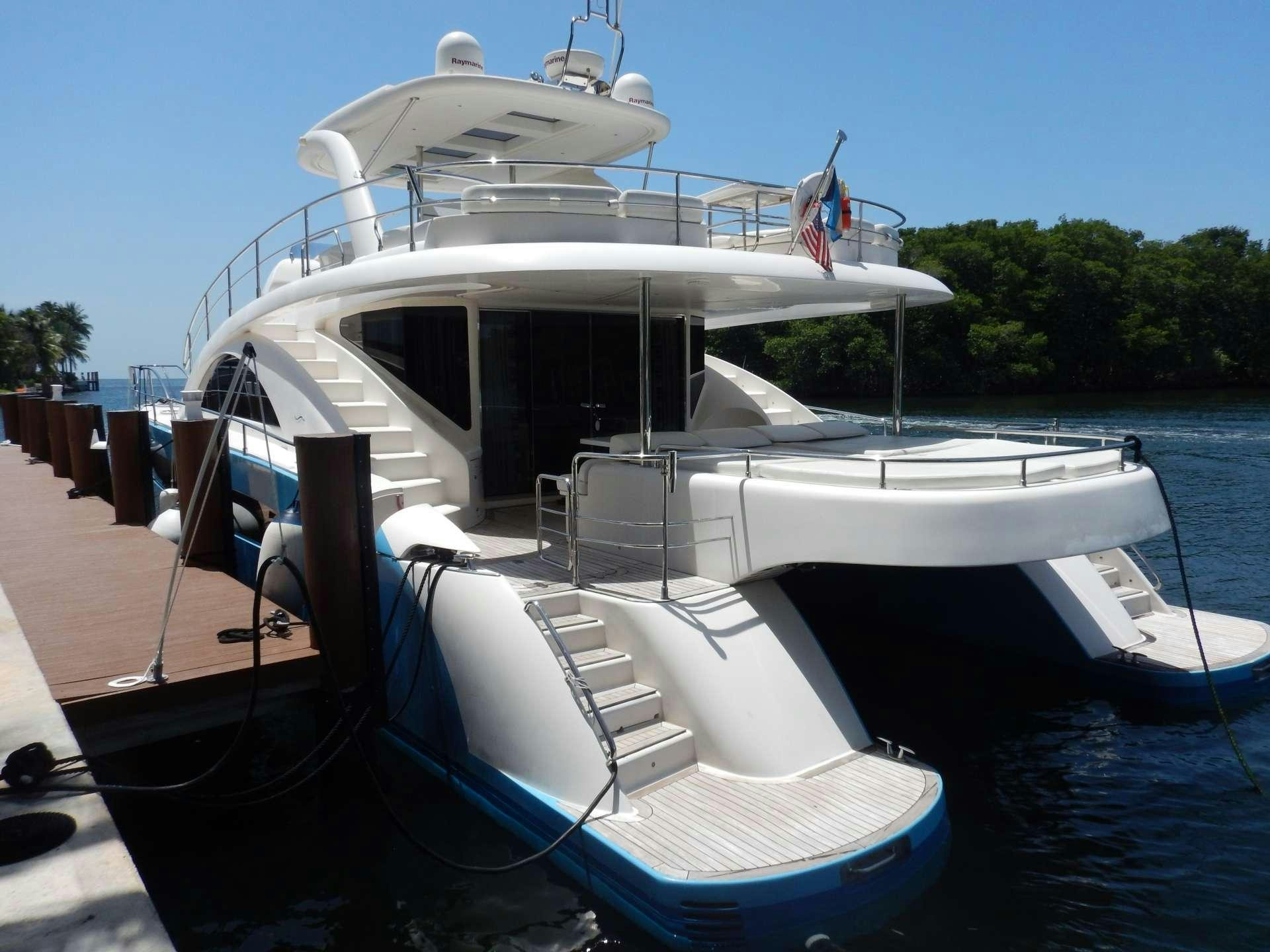 a boat docked at a dock aboard MAGIC STAR Yacht for Charter