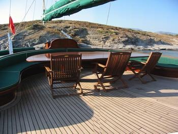 chairs and a table on a deck aboard KAPTAN YILMAZ Yacht for Charter