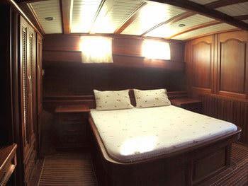 a bed in a room aboard KAPTAN YILMAZ Yacht for Charter