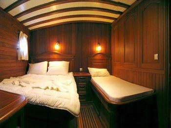 a room with two beds aboard KAPTAN YILMAZ Yacht for Charter